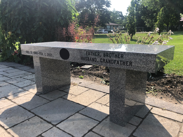custom charcoal granite gravestone in a cemetary